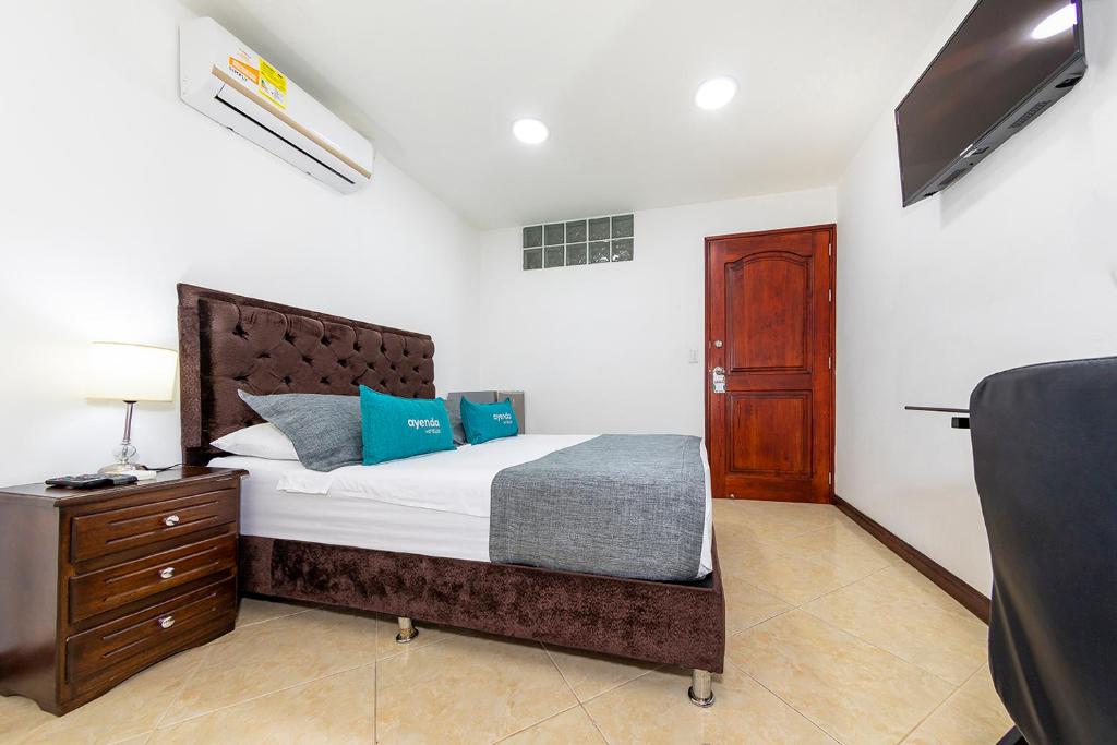 Postel nebo postele na pokoji v ubytování Hotel Ayenda Palo Alto