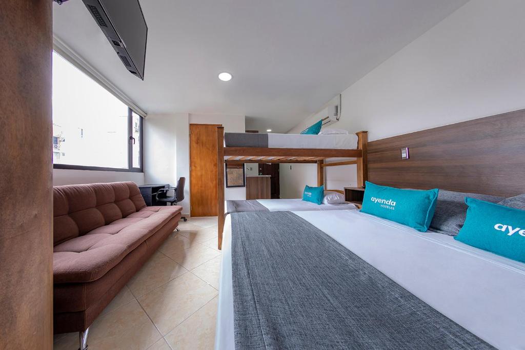 Postel nebo postele na pokoji v ubytování Hotel Ayenda Palo Alto