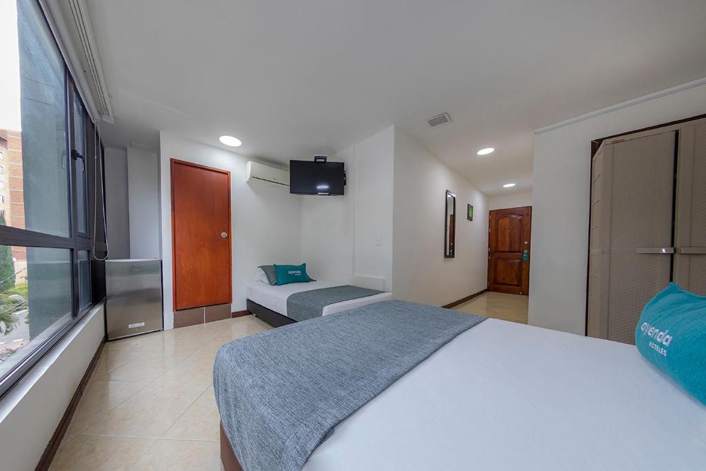 Postel nebo postele na pokoji v ubytování Hotel Ayenda Palo Alto