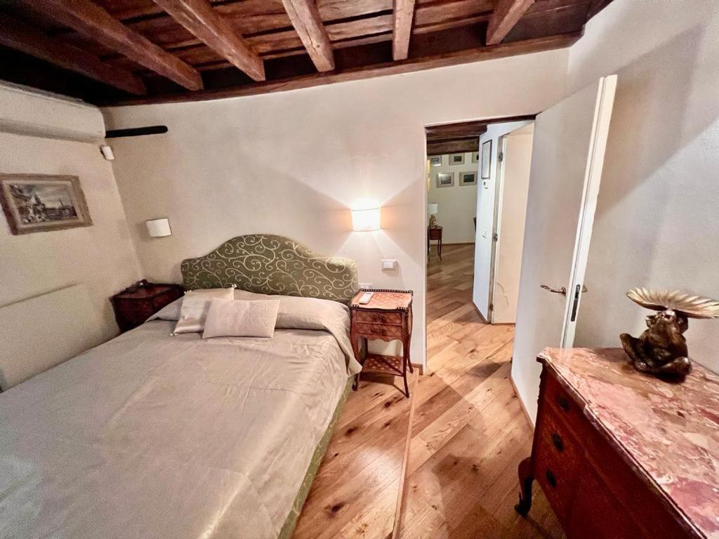 A bed or beds in a room at Torre della Scimmia apartment