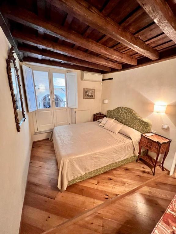 A bed or beds in a room at Torre della Scimmia apartment