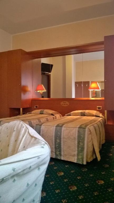 Postel nebo postele na pokoji v ubytování Hotel Green castellani