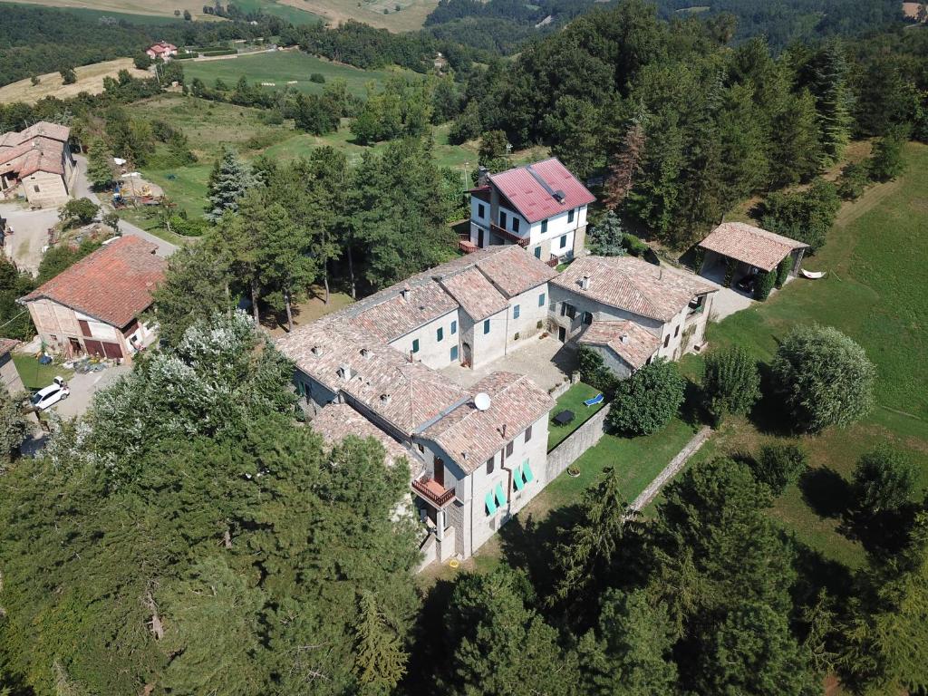 an aerial view of a large house in a field at La Corte Bonomini in Neviano degli Arduini