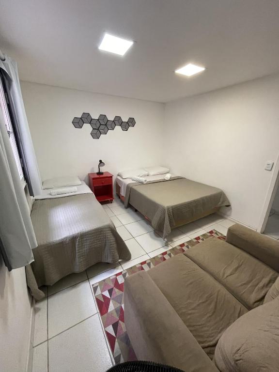 Postel nebo postele na pokoji v ubytování Social Hostel Café e Bar