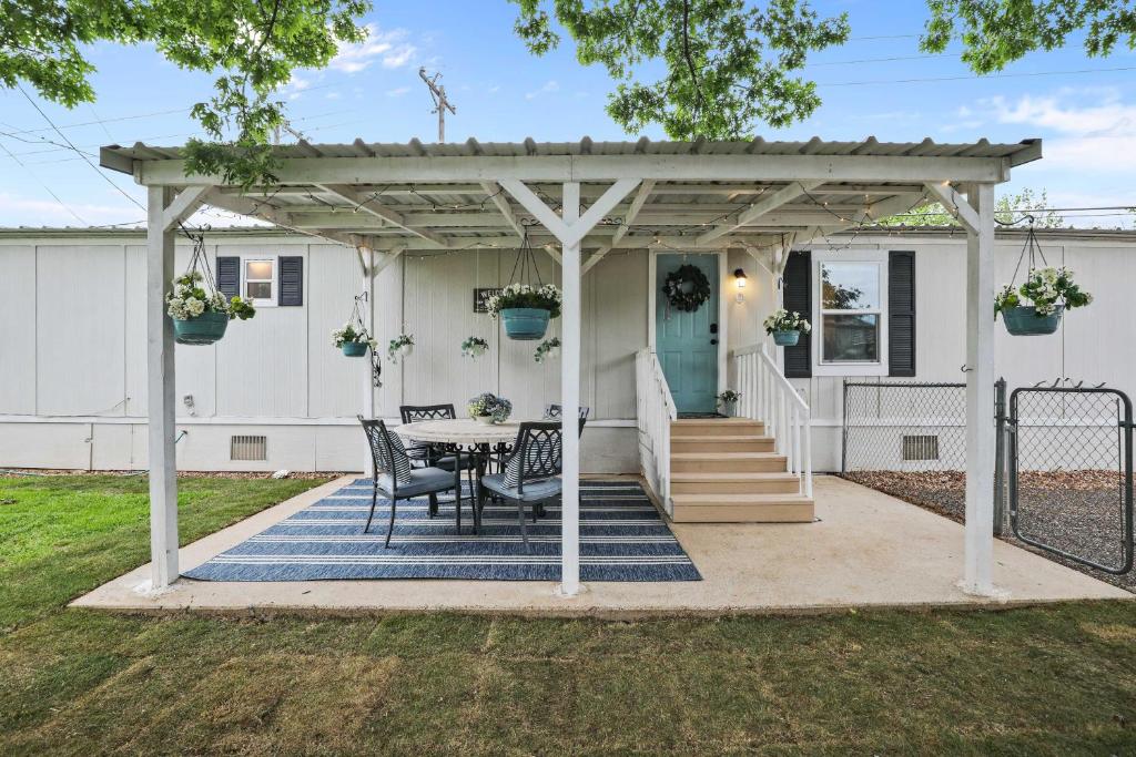a pergola on a house with a table and chairs at Boat and Fish on Lewisville Lake Pet-Friendly Haven in Lake Dallas