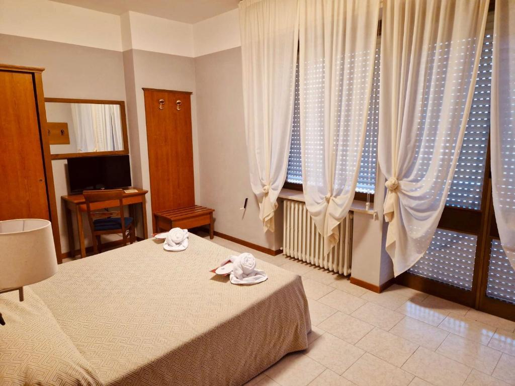 Postelja oz. postelje v sobi nastanitve Hotel Roccaporena & Margherita