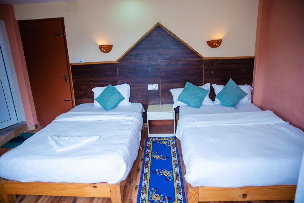 Cama o camas de una habitación en Hotel Olympus Pokhara