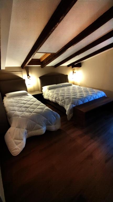 Postel nebo postele na pokoji v ubytování Hotel Emiliana