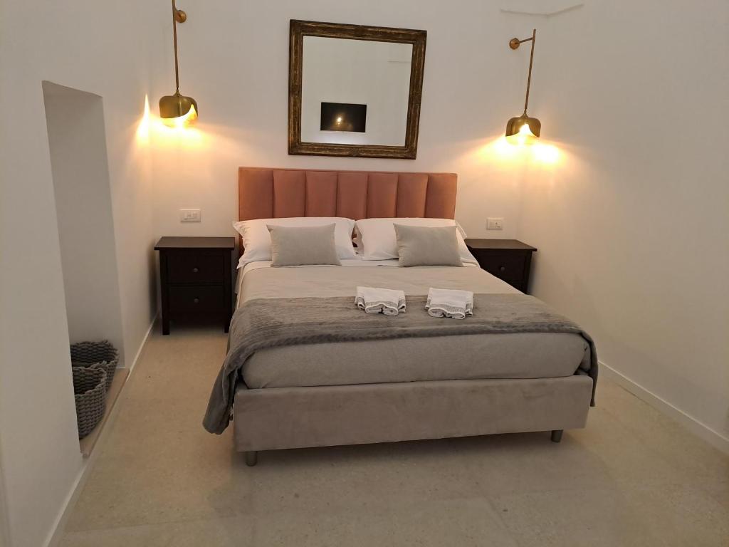 Postel nebo postele na pokoji v ubytování Palazzo AD 1892 - SUITES & SPA