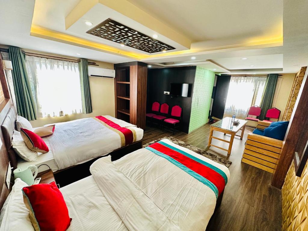 Postel nebo postele na pokoji v ubytování Hotel Airport Deepshree