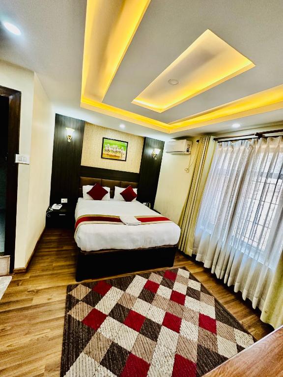 Postel nebo postele na pokoji v ubytování Hotel Airport Deepshree