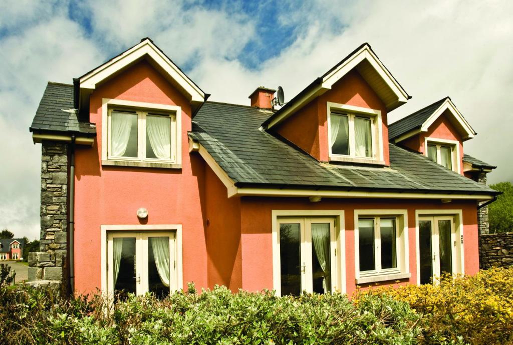 a red house with a black roof at Ring Of Kerry HC No 20 in Kenmare