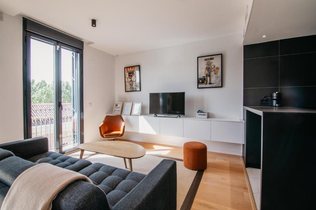 TV a/nebo společenská místnost v ubytování tuGuest Obispo Apartment