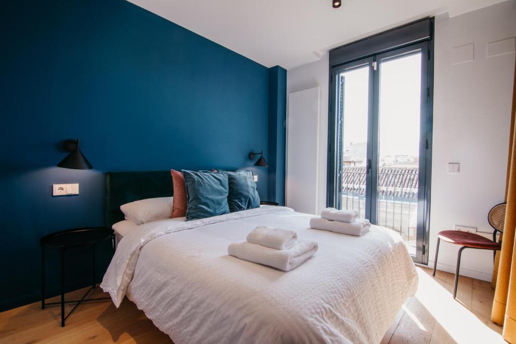 Postel nebo postele na pokoji v ubytování tuGuest Obispo Apartment