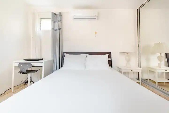 Postel nebo postele na pokoji v ubytování Rincón Caribeño Habitación Privada en Apartamento