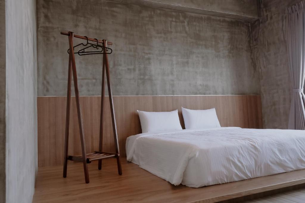 Postel nebo postele na pokoji v ubytování Huiwei B&B