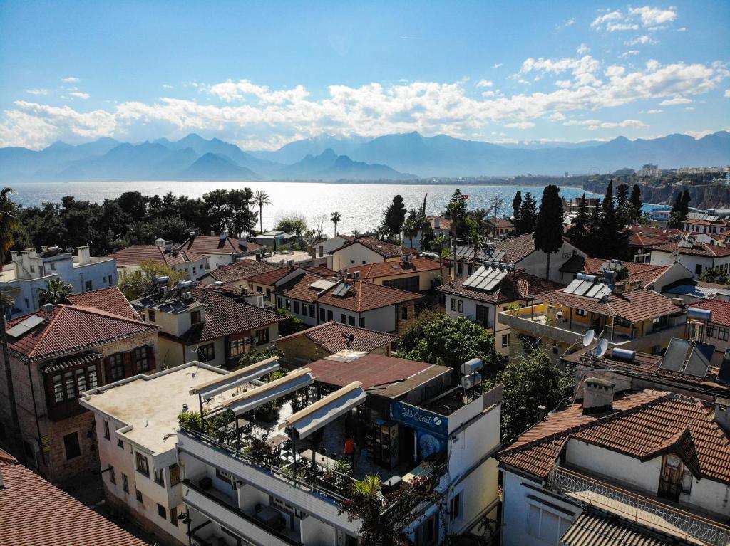 an aerial view of a city with buildings and the water at Gold Coast Hostel in Antalya
