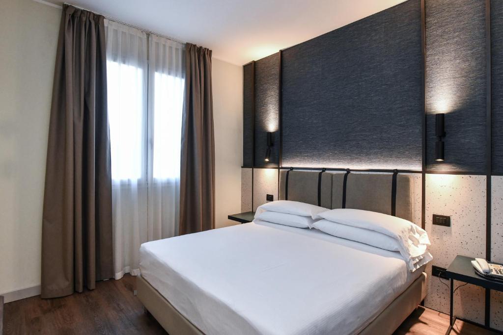 Postel nebo postele na pokoji v ubytování Hotel Eden