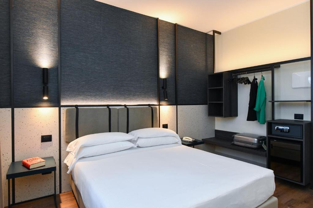 Postel nebo postele na pokoji v ubytování Hotel Eden