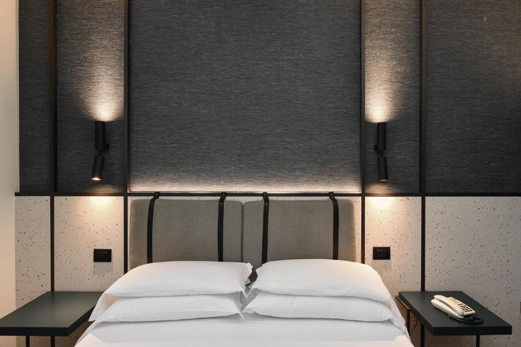 Postel nebo postele na pokoji v ubytování Hotel Eden