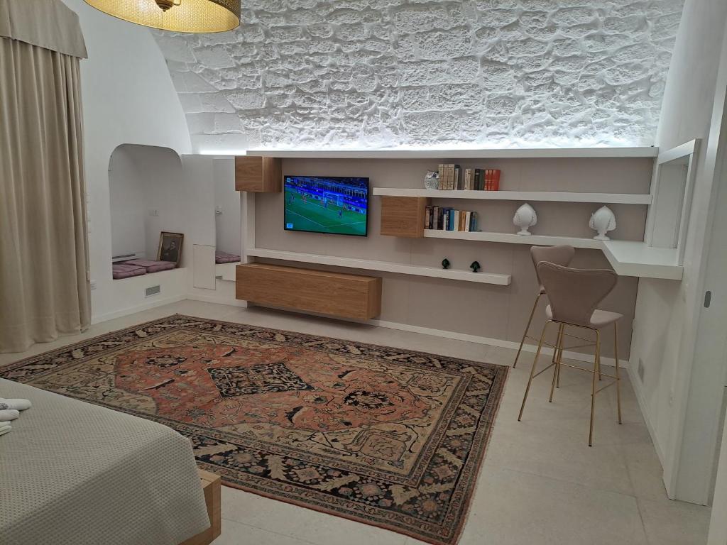 TV a/nebo společenská místnost v ubytování Palazzo AD 1892 - SUITES & SPA