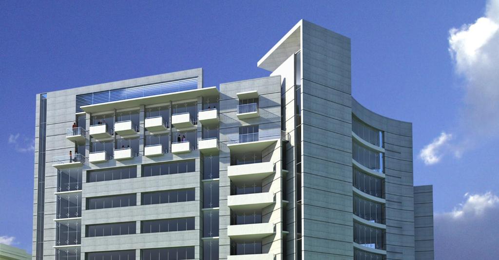 a tall glass building with a sky at DESHA TARC in Kushtia