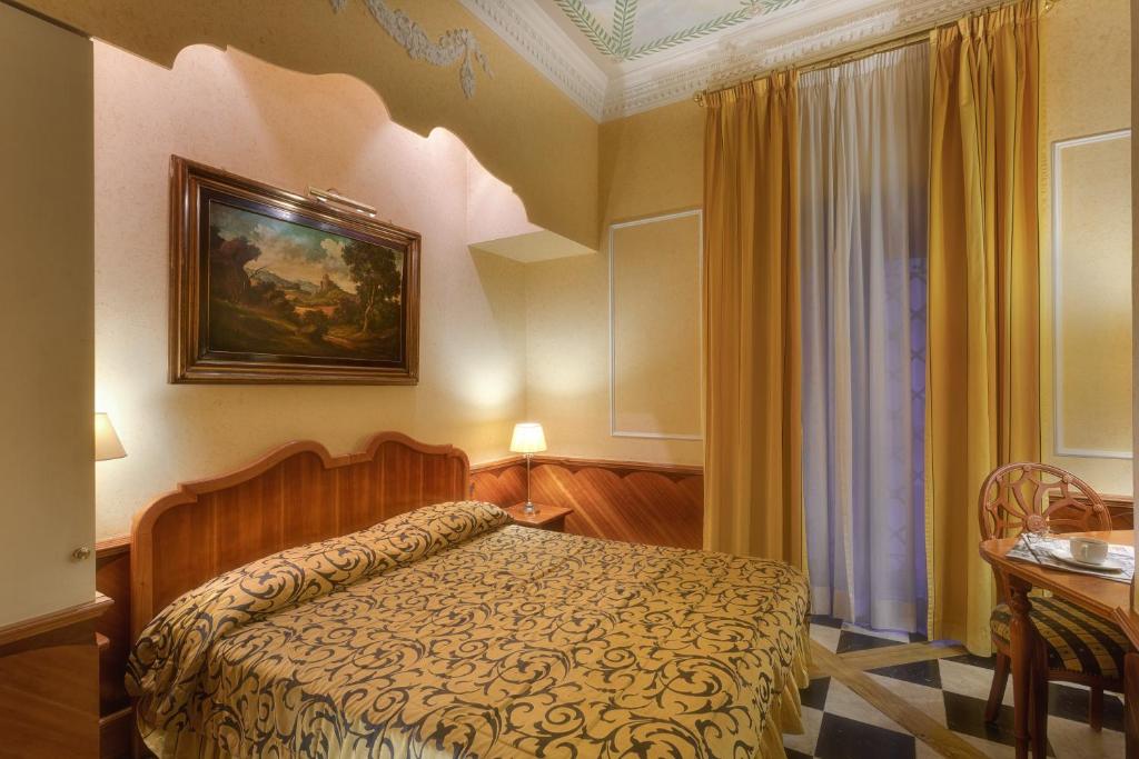 Postel nebo postele na pokoji v ubytování Hotel Bolivar