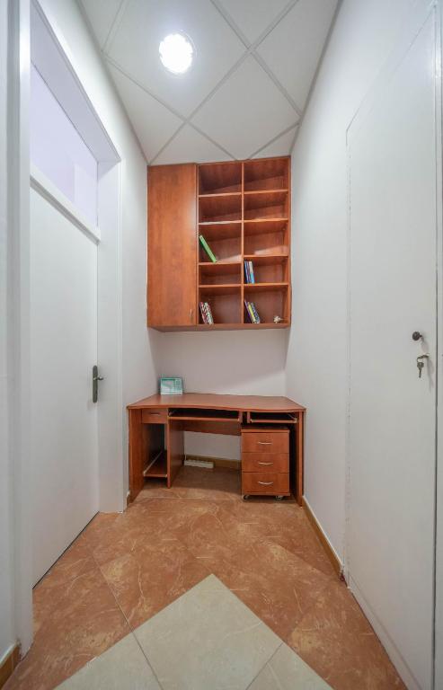 an office with a desk in a room with a door at Main Square View in Kotor