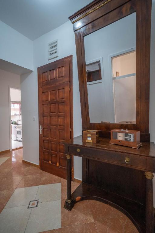 a mirror and a dressing table in a room at Main Square View in Kotor