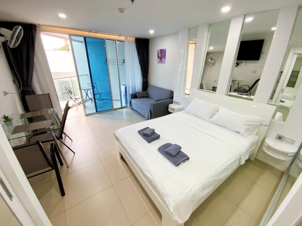 Postel nebo postele na pokoji v ubytování Sands Condo Studio 015 by ThaiminatorPattaya