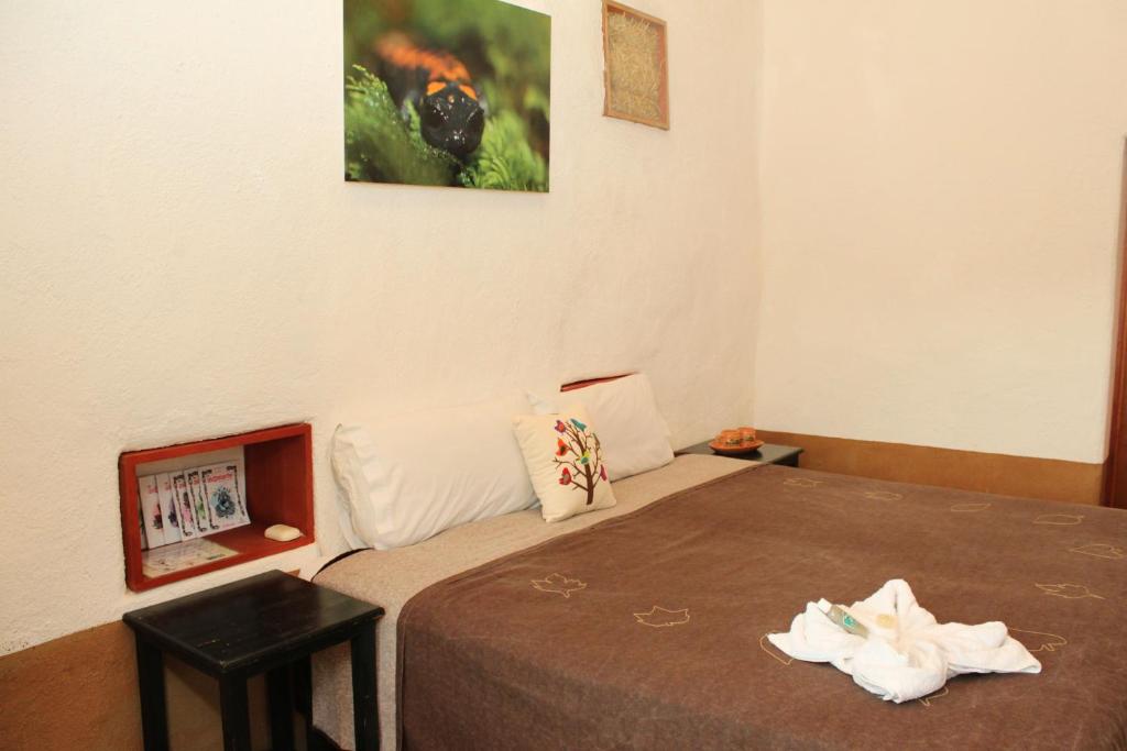Postel nebo postele na pokoji v ubytování Cabañas Sierra Gorda