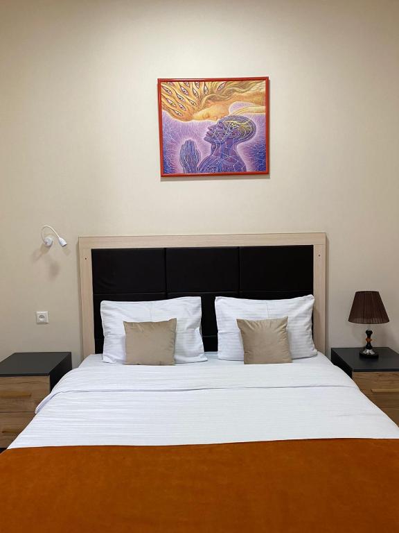 Кровать или кровати в номере Alex Hotel