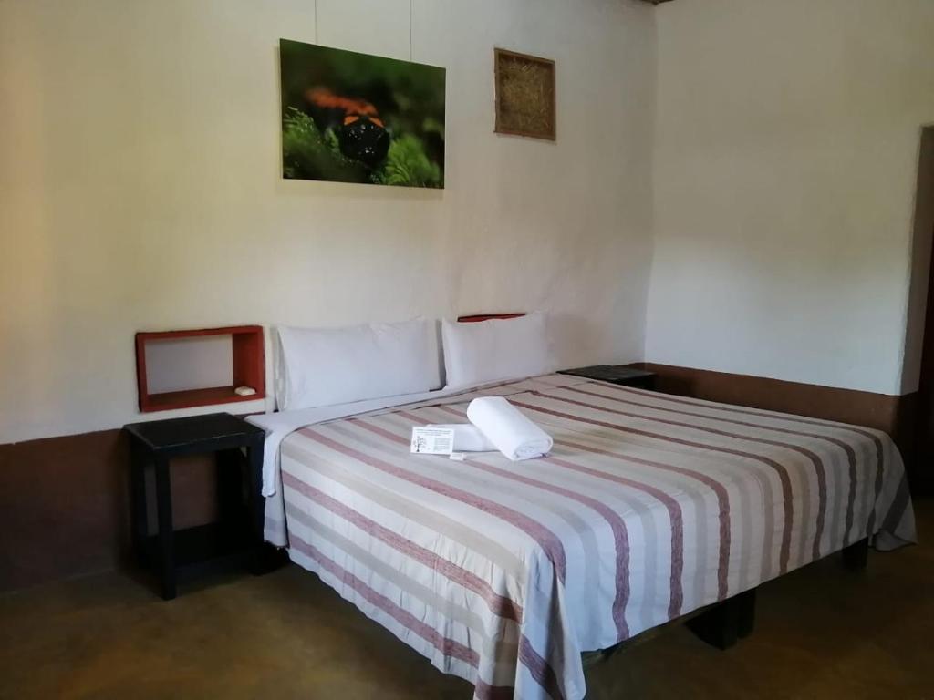 Postel nebo postele na pokoji v ubytování Cabañas Sierra Gorda