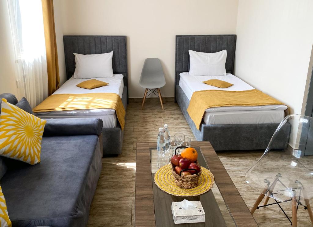 Кровать или кровати в номере Alex Hotel
