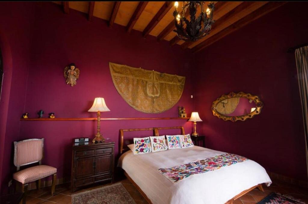 Postel nebo postele na pokoji v ubytování Casa Don Pascual Hotel Boutique Sweet Home