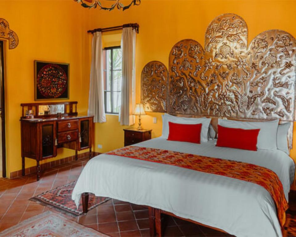 Postel nebo postele na pokoji v ubytování Casa Don Pascual Hotel Boutique Sweet Home