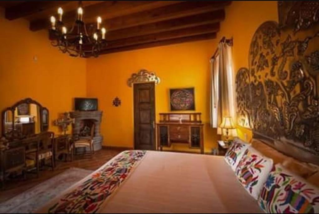 Postel nebo postele na pokoji v ubytování Casa Don Pascual Hotel Boutique Sweet Home