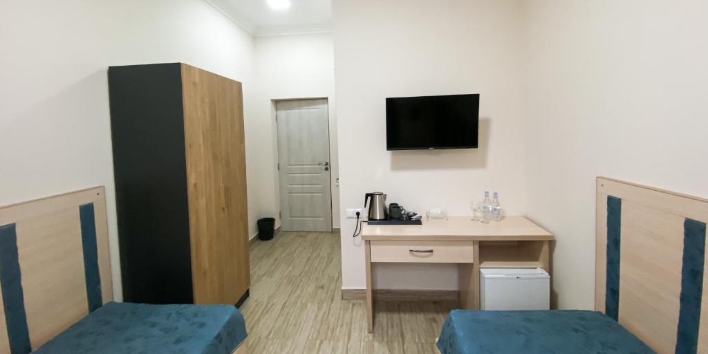 Телевизор и/или развлекательный центр в Alex Hotel