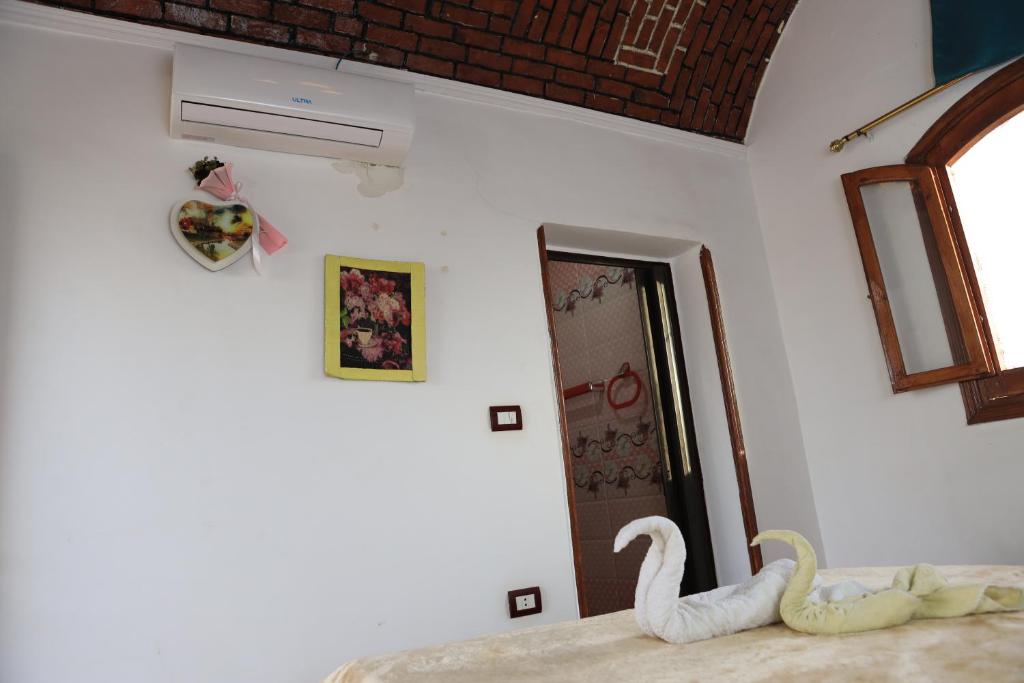 Postel nebo postele na pokoji v ubytování Memnoun house