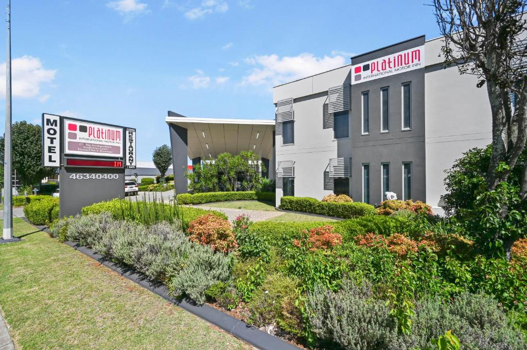 a building with a sign in front of it at Platinum International in Toowoomba