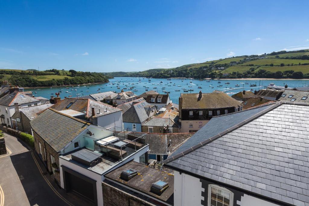 an aerial view of a town with a river and boats at 2 Church Hill House in Salcombe