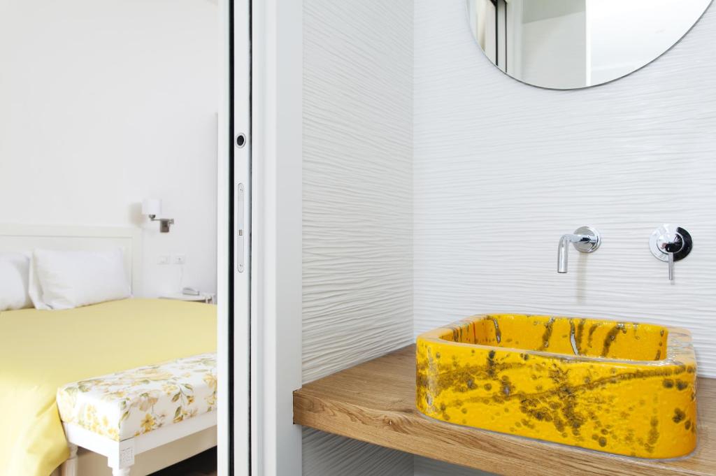 Postel nebo postele na pokoji v ubytování Hotel Ideale