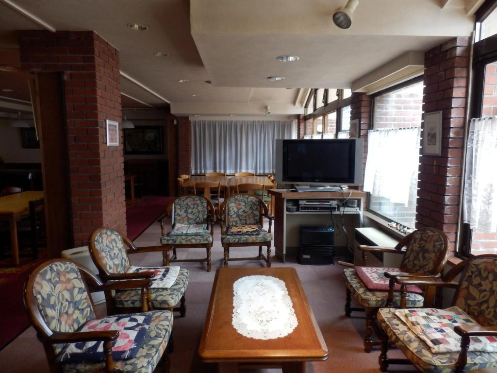 TV a/nebo společenská místnost v ubytování Hotel Weisser Hof Happei