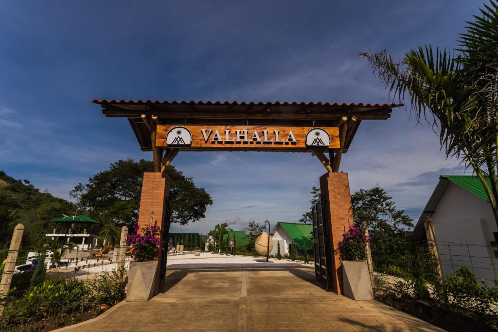 a gate with a sign that reads vallarta at Valhalla Nimaima Glamping in Nimaima