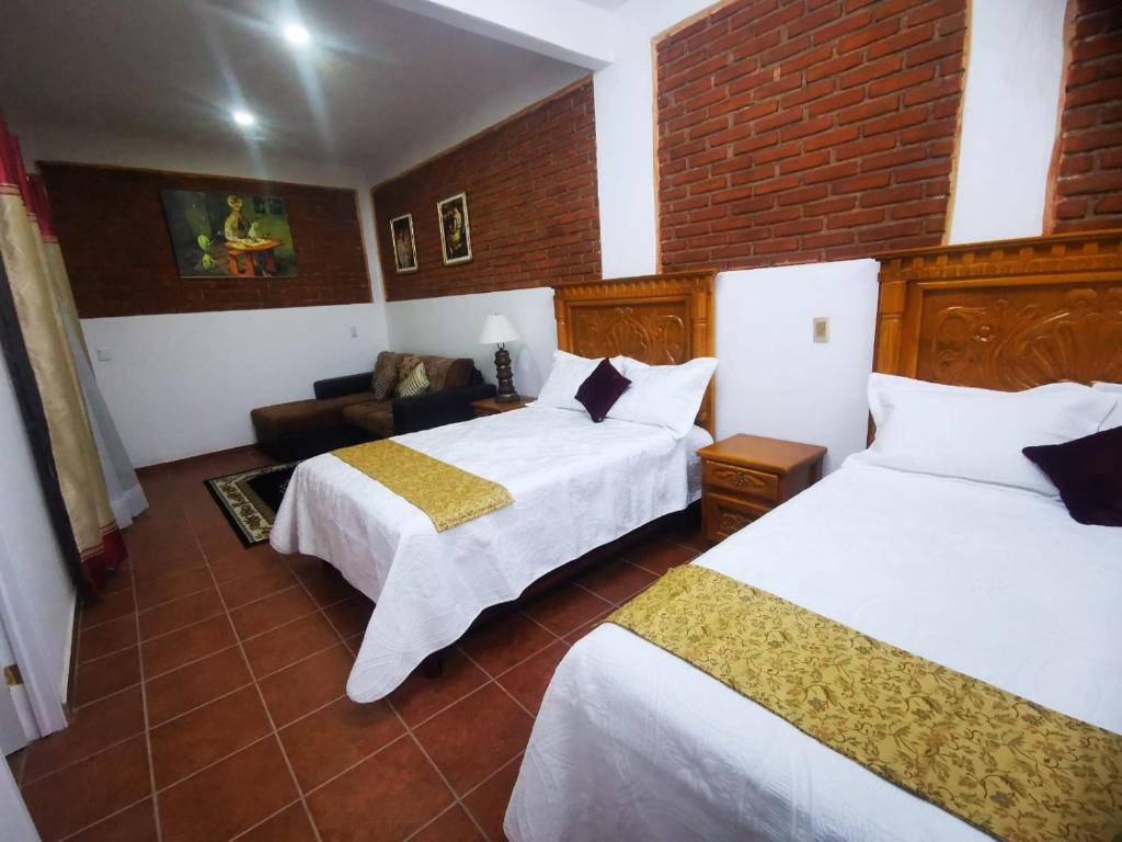 Postel nebo postele na pokoji v ubytování Hotel Boutique Casona Mashei