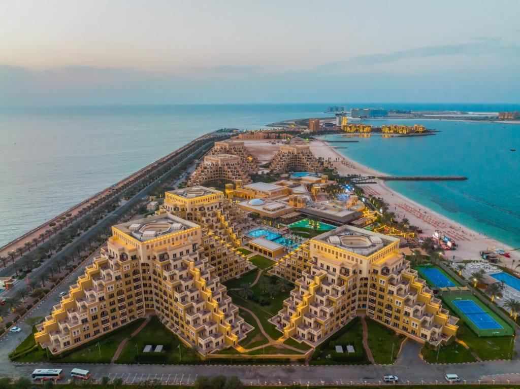 an aerial view of a resort near the ocean at Nice Studio Near The Sea in Ras al Khaimah