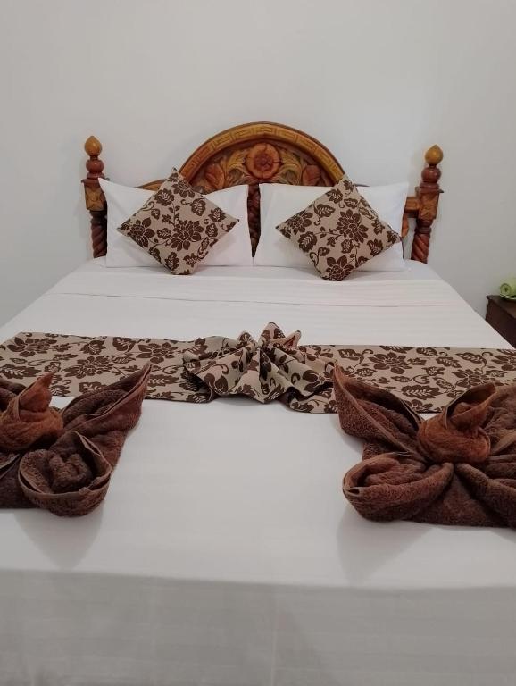 Postel nebo postele na pokoji v ubytování Joevanna Cottage