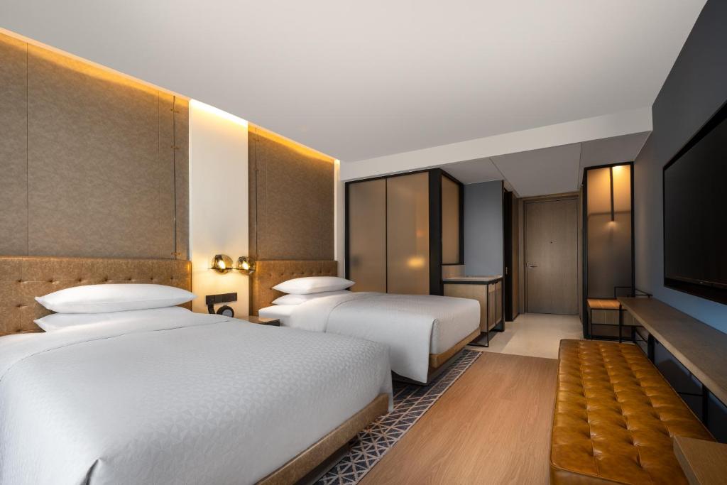 Postel nebo postele na pokoji v ubytování Four Points by Sheraton Chongqing, Yongchuan