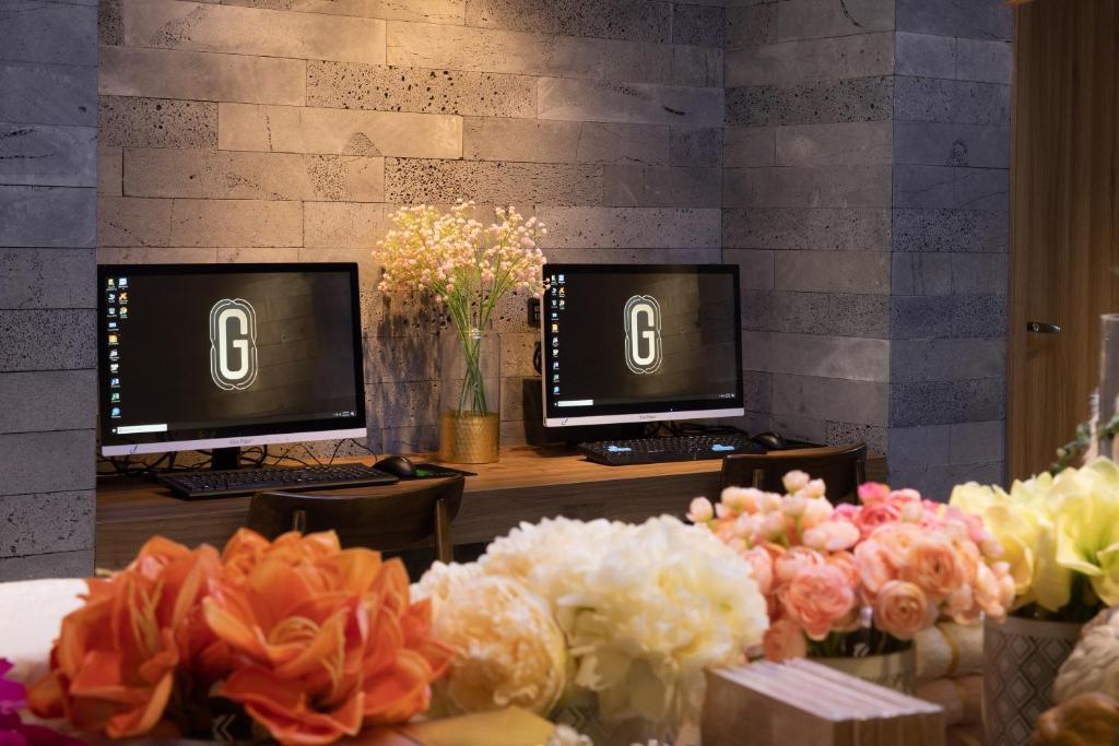 TV in/ali zabaviščno središče v nastanitvi The Glomad Boutique Danang
