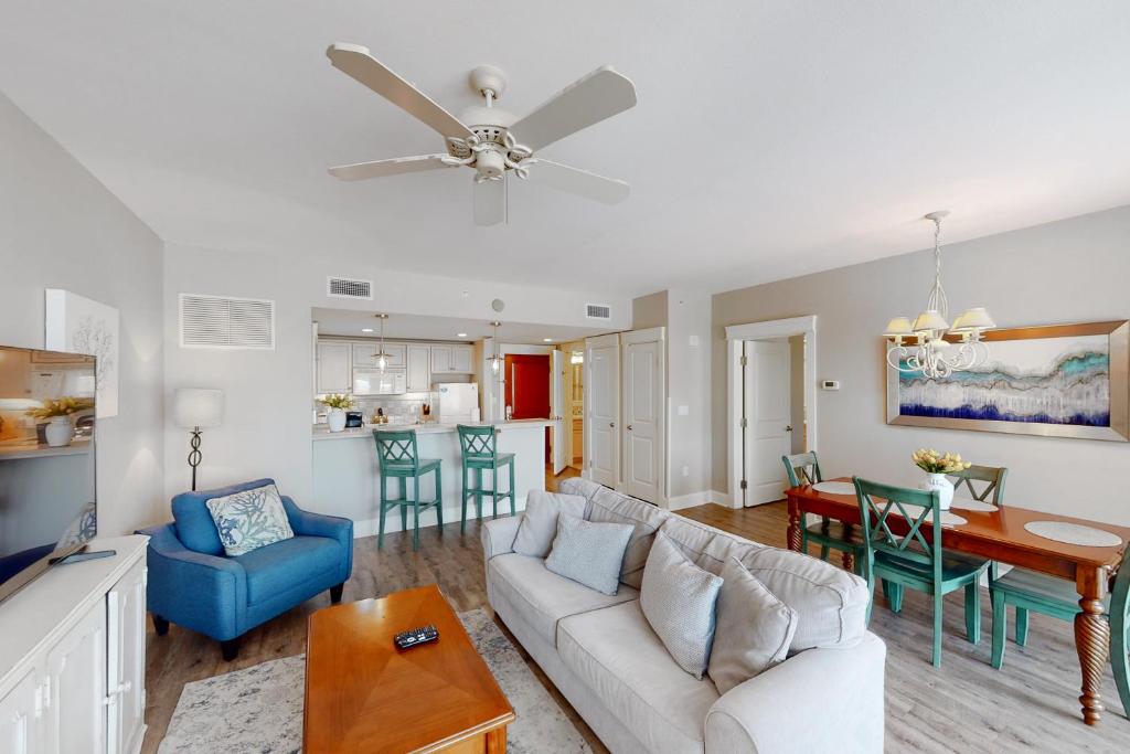 a living room with a couch and a table at Grand Sandestin #2317 in Destin